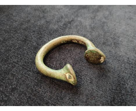 Early 18th Century West African copper Manilla "slave money" bangle. These bangles were made in Birmingham and used as curren