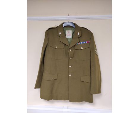 British Army uniform, an olive green jacket with J Compton Sons and Webb Ltd label "SSGT ROBERTS24592273" having S and W Ltd 