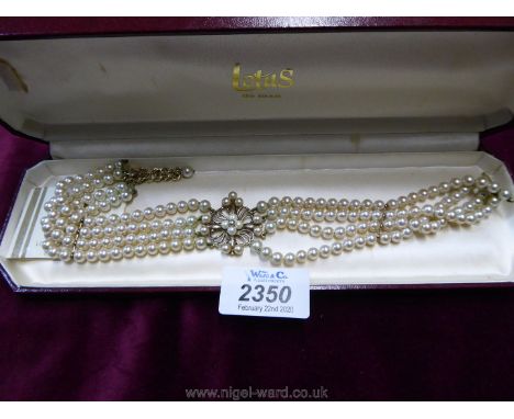 A vintage Lotus simulated pearl four strand choker.