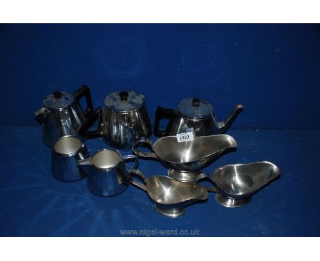 A four piece Doric ware Teaset plus stainless steel sauce boats and teapot.