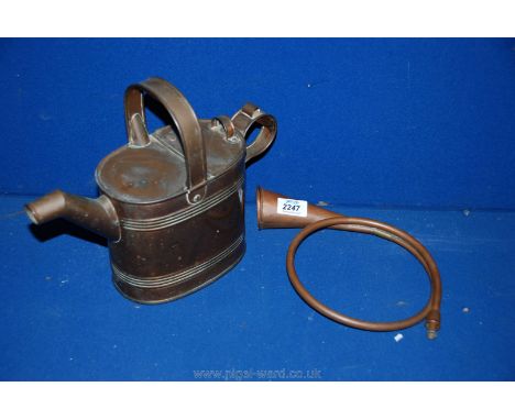 A brass Watering Can and brass hunting bugle.