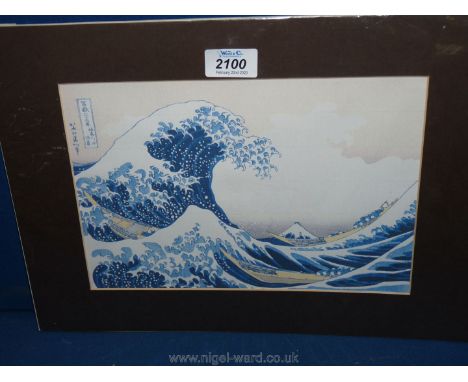 A mounted oriental Print depicting boats carrying a figure on rough seas.