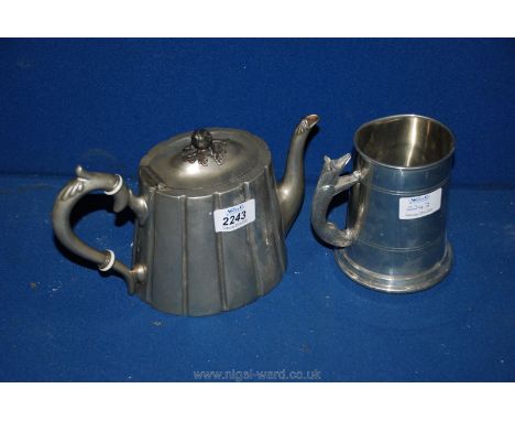 A Pewter Teapot with acorn lid and Pewter Tankard with a fox handle.