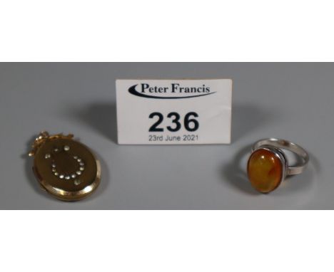 Silver and amber ring and a gold plated (9ct gold 'back and front') locket.(B.P. 21% + VAT) 