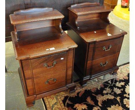 A pair of reproduction mahogany finish bedside cabinets having two drawers on bracket feet. (2)(B.P. 21% + VAT) 