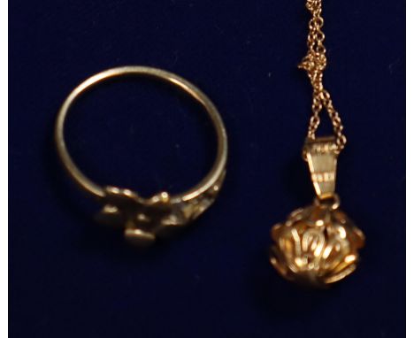 18ct gold pendant and chain and a 9ct gold flower ring.  Ring size L&1/2/  Approx weight in total 3.8 grams.(B.P. 21% + VAT) 