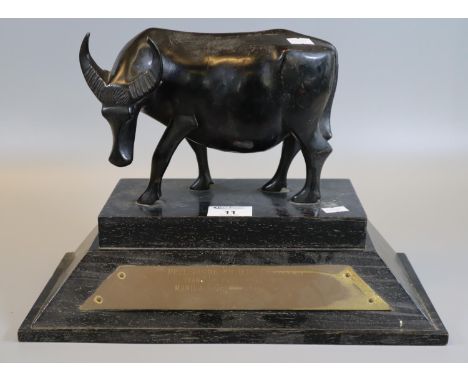 Unusual presentation trophy of a carved water buffalo with plaque 'Philippine bridge festival, team of the Championship Manil