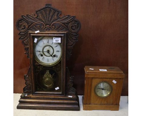 Early 20th Century carved oak architectural probably American two train mantel clock. Together with a German oak cased mantel