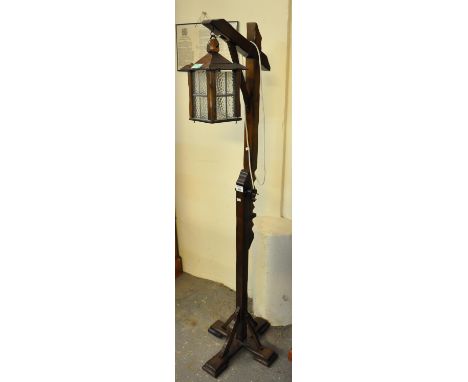 Reproduction oak hanging lantern standard lamp on quatreform base. (B.P. 21% + VAT) 
