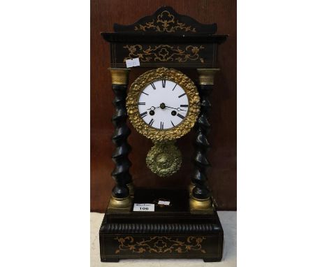 Late 19th/early 20th Century ebonised architectural enamel two train mantel clock having four barley twist pillars with folia