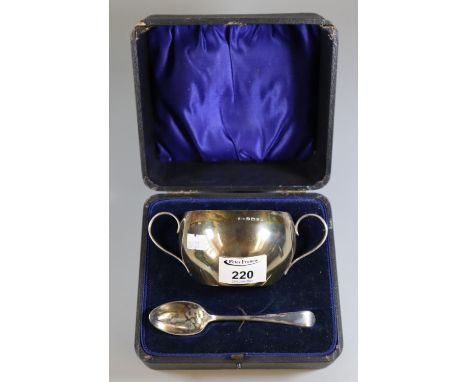 Silver two handled sucrier and spoon, Birmingham hallmarks. 4.6 trot oz (B.P. 21% + VAT) Both items distorted/tarnished, very
