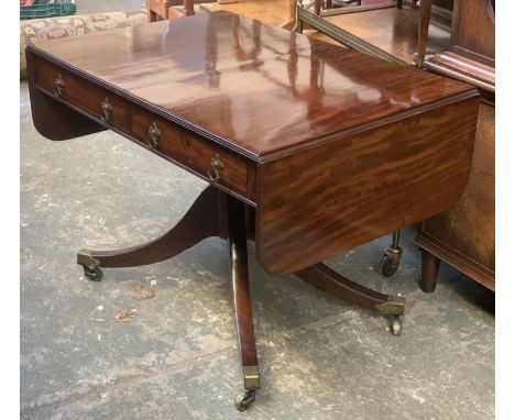 A Regency mahogany sofa table, two frieze drawers, on a turned column and sabre legs, 103x69x72cmH, each leaf an additional 3