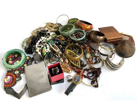 A mixed lot of costume jewellery to include necklaces; bangles; costume rings; cigarette case; Swatch watch etc 