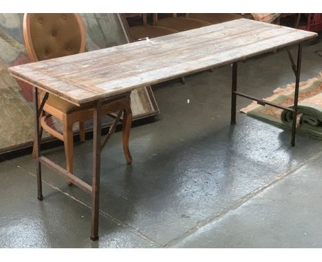 A vintage trestle table on folding metal legs, 178x60x75cmH 