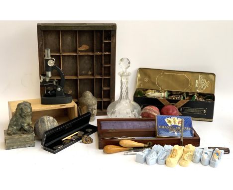 A mixed lot to include small microscope, decanter, soapstone foo dog, dental models, drawing instruments, RAF badge, type tra