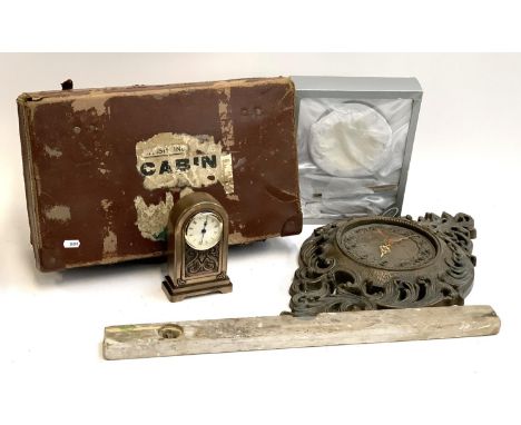 A vintage travel case, together with a spirit level, resin mantel clock, resin wall clock, christening set 