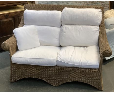 A wicker two seater conservatory sofa with loose cushions, 145cmW 