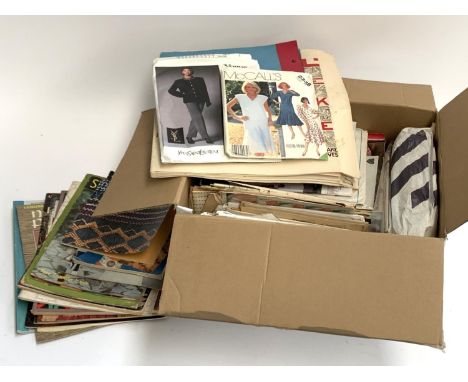 A quantity of vintage knitting patterns and manuals to include Yves Saint Lauren etc 