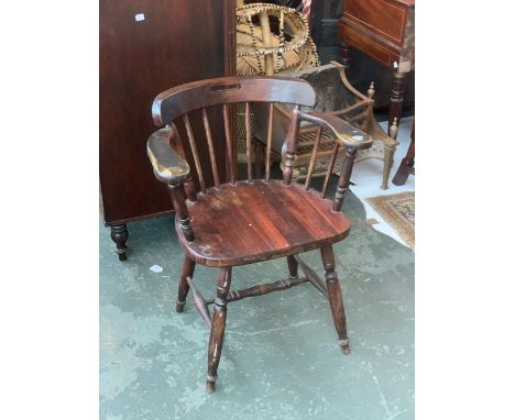 A 20th century captain's or smokers bow stick back armchair 