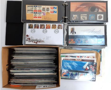 A large quantity of Royal Mail presentation packs and first day covers in 2 albums and a box, to include the 100th year of Qu