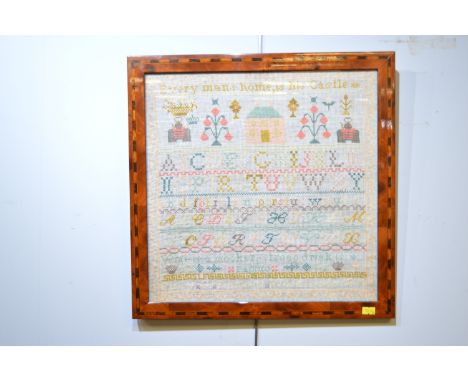 A late 19th Century needlework sampler, inscribed 'Everyman and his home is his castle' above buildings, flowers, alphabet, b
