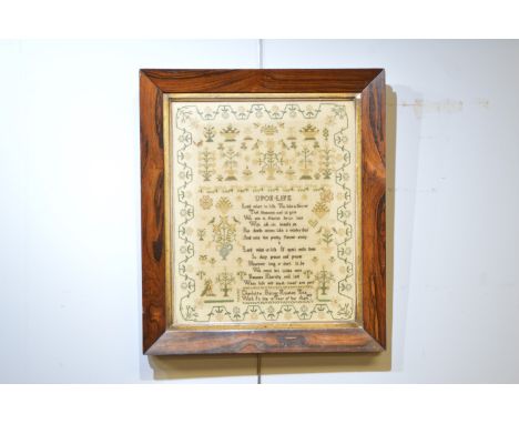 A 19th Century needlework sampler, decorated with religious verse, flowers, animals and inscribed 'Charlotte Bailey finished 