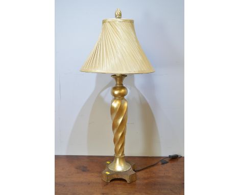 A modern gold painted and spirally fluted table lamp, concave sided base, pleated shade, 89cms high.