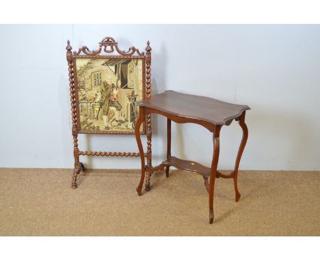 A late Victorian carved oak firescreen, rectangular needlework panel between barley-sugar twist uprights and carved scroll fr