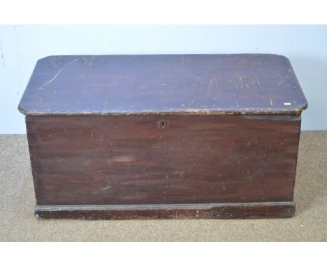 A vintage stained pine trunk, canted rectangular, with metal carrying handles, 103 x 52 x 49cms high.