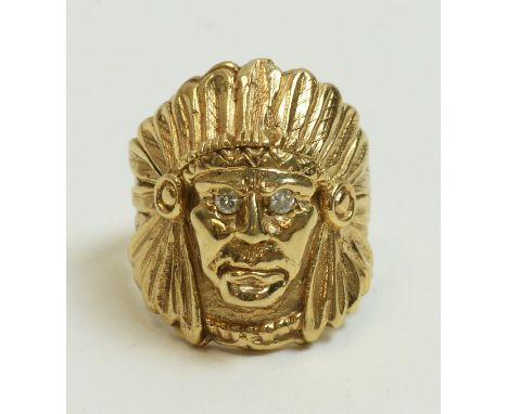 Yellow metal Indian Chief pattern ring, with brilliant-cut diamond set eyes, unmarked, ring size U 1/2, 22.7g gross.