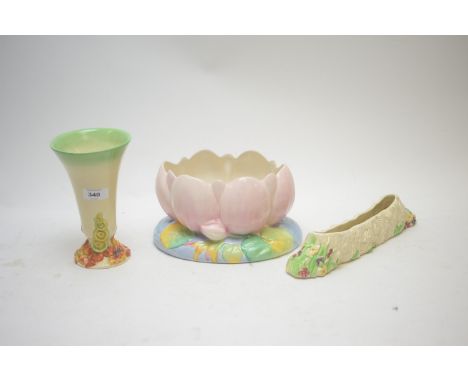 Clarice Cliff for Royal Staffordshire 'Lily' pattern bowl; a Newport pottery vase with flower decoration; and a Wilkinson flo