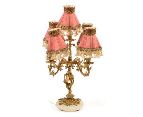 A 19th Century five-branch ormolu chandelier, later converted into a lamp, with foliate scroll branches raised on a white ony