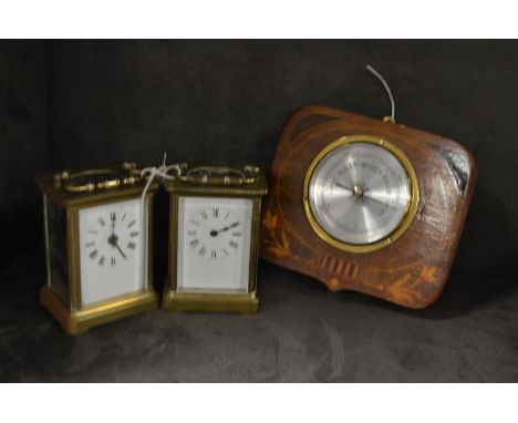 Two brass cased carriage clocks with white enamel roman dial; together with an inlaid mahogany cased barometer.
