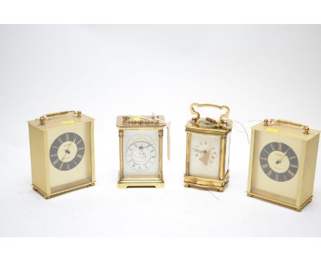 An early 20th Century brass cased carriage clock by Rapport, London, 16cms high; together with three other brass cased carria