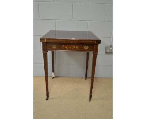 An Edwardian inlaid mahogany envelope card table, with boxwood stringing and satinwood banding, the underlying drawer with in