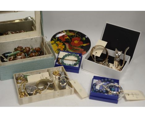 A selection of costume jewellery, including: white and yellow metal earrings; pendants; bracelets; and other items; a metal c