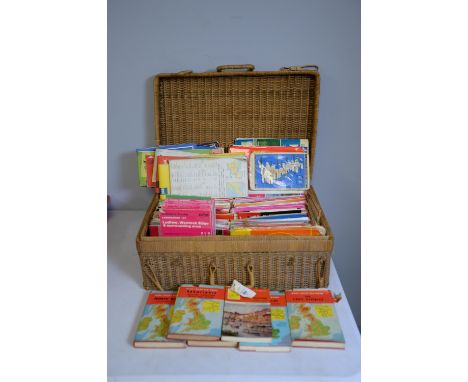 Ordnance Survey and other maps, including: Ward Lock Red Guide, in a wicker basket.