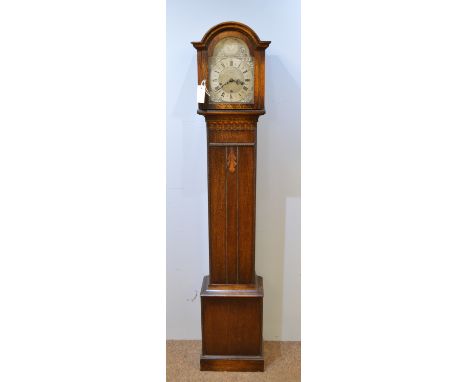 A mid 20th Century oak longcase clock, with silvered Tempus Fugit dial and retailers mark of Lister, the three train movement