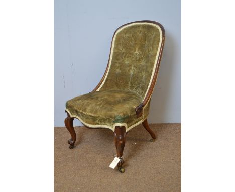 A Victorian rosewood button-back nursing chair, with serpentine seat rail, slender French scroll legs, brass castors.