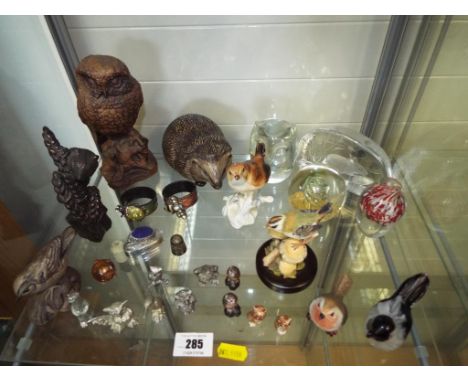 A good mixed lot to include a collection of white metal an pewter miniature animals, a Poole Pottery hedgehog, a Poole Potter