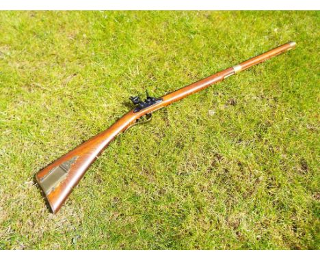 A replica flintlock rifle in the style of a short hunting rifle