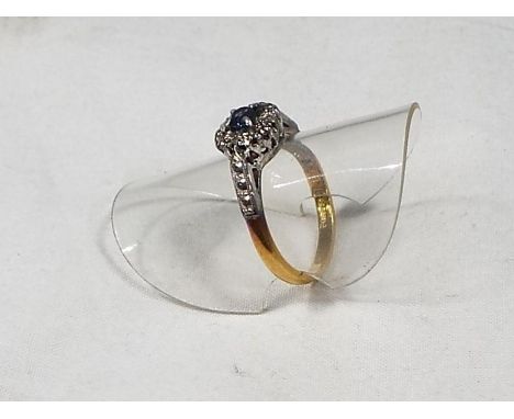 A lady's 18 carat gold ring set with diamonds and centre sapphire, size K, approximate weight 3.65 g. Boxed.