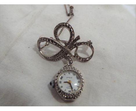 A good quality lady's silver and marcasite watch brooch by Rotary, 21 jewels, boxed. Estimate £20 - £40
