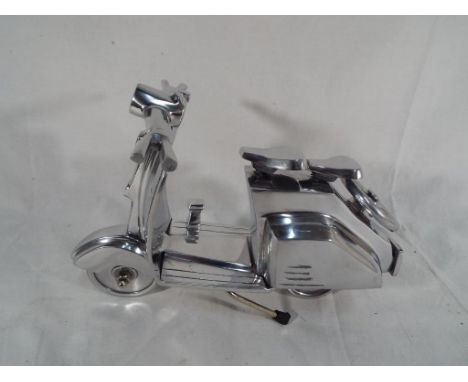 A chrome Vesta scooter Est £20 - £40