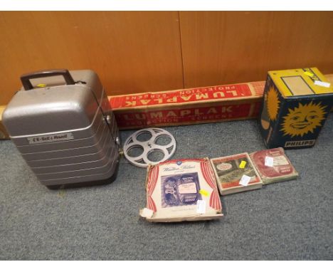 A GB Bell and Howell 8 mm projector with screen, Phillips bulb and 3 8 mm films entitled "Walton Films Presents Laurel and Ha