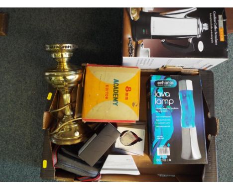 A good mixed lot to include a cordless coffee percolator, a lava lamp, 2 digital photo viewers, an Academy 8 MM film editor, 