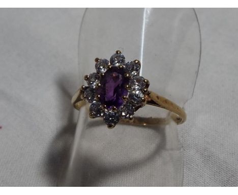 A lady's hallmarked 9 carat gold amethyst and cz ring, approximate weight 1.6 grams size N, boxed