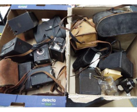 Photographic equipment - two boxes containing a large collection of photographic equipment to include vintage cameras, two bi