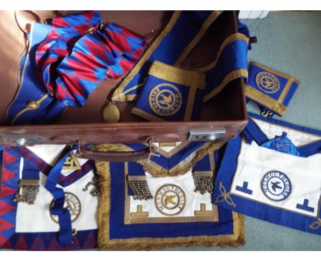 A vintage brown leather suitcase containing Monmouthshire Masonic Lodge regalia