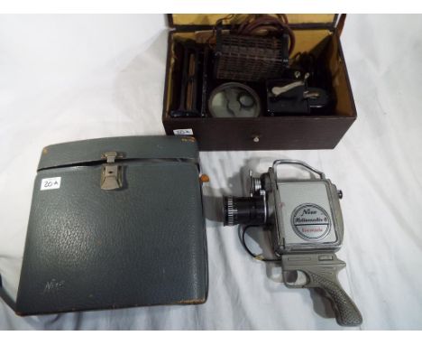 A Pathe "Baby Projector" in case and a Nizo, Heliomatic 8, Focovario hand held film camera with case.